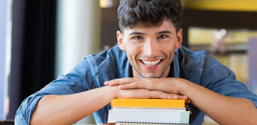 How to get an A in Maths -Boy with all his books