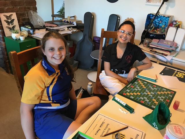 Brisbane grade five student CC with her tutor Michaela playing Scrabble